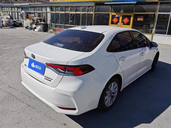 Corolla 2021 Hybrid 1.8L E-CVT Elite Edition, Февраль 2022 г., пробег 20700 км. (Б/у) Передний — изображение 2